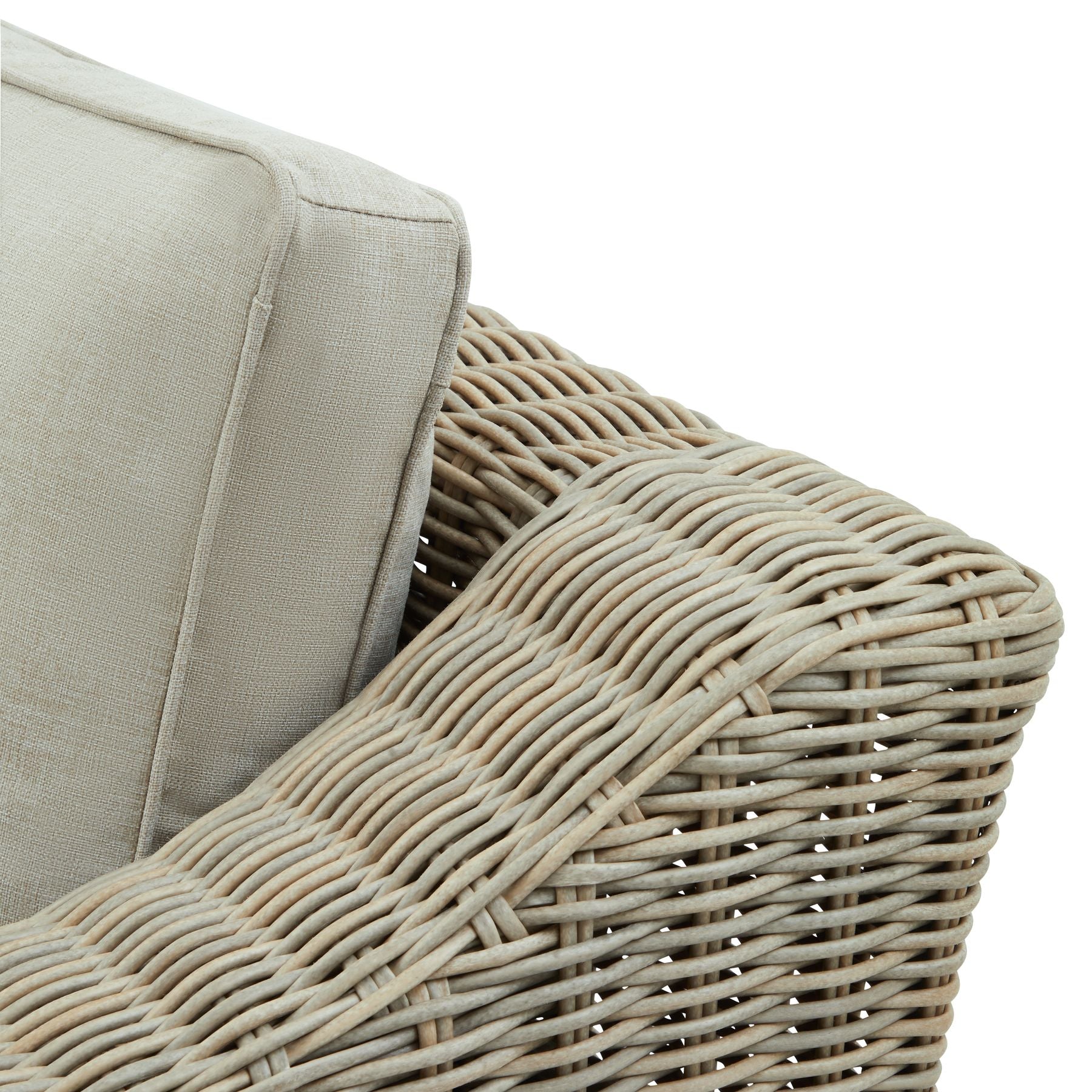 Wicker outdoor armchair with cream cushions