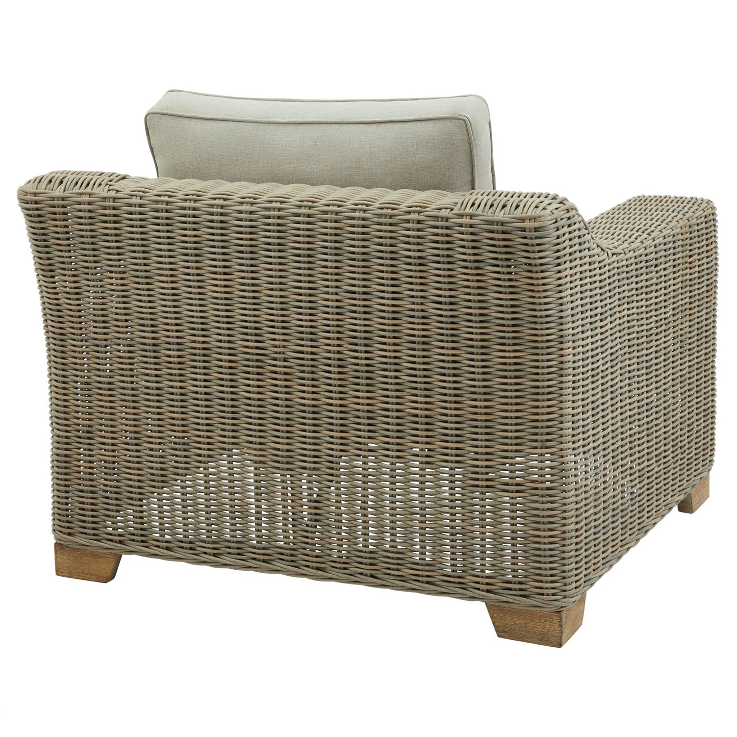 Wicker outdoor armchair with cream cushions