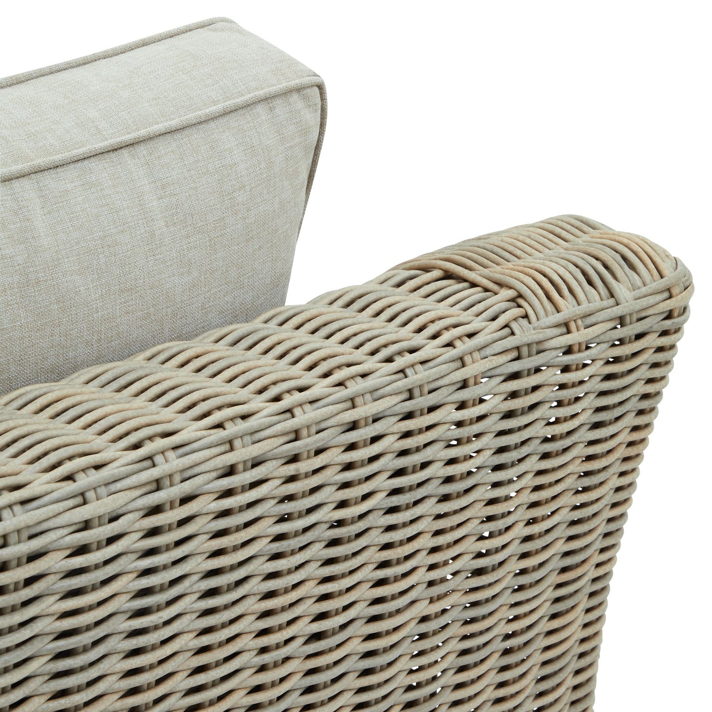 Wicker outdoor armchair with cream cushions