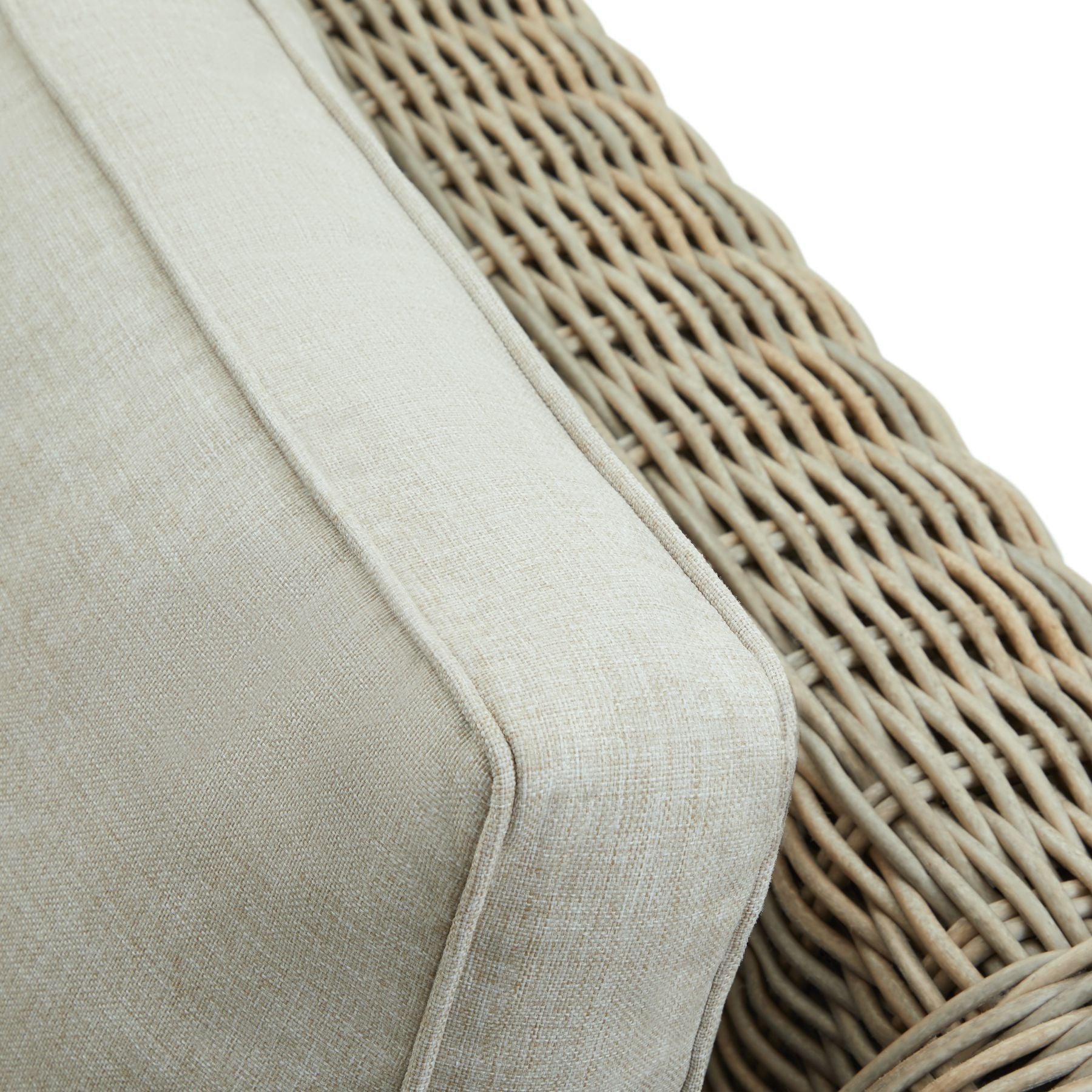 Wicker style outdoor sofa with cream cushions