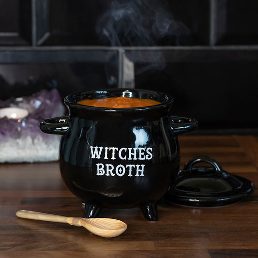A black soup bowl in the shape of a cauldron with the wording 'witches broth' on the front. comes with a lid and broom shaped spoon suitsble for Halloween