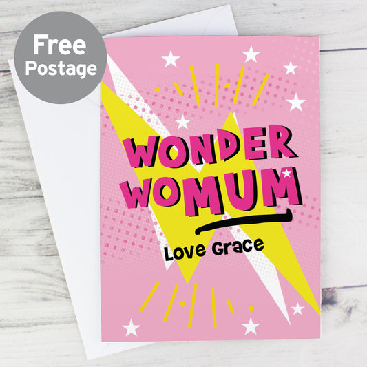 Pink greetings card with lightening and star design on front and the words ‘Wonder WoMum’