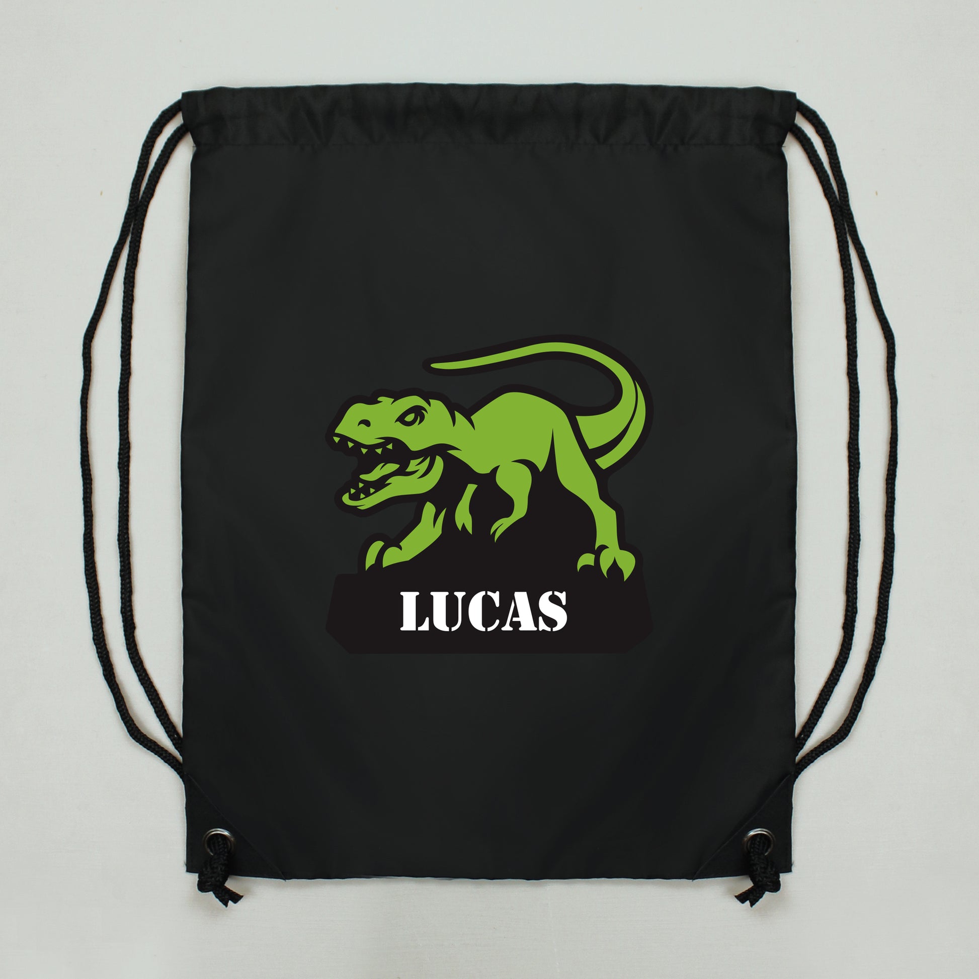 Black drawstring kit bag with dinosaur picture and personalised names