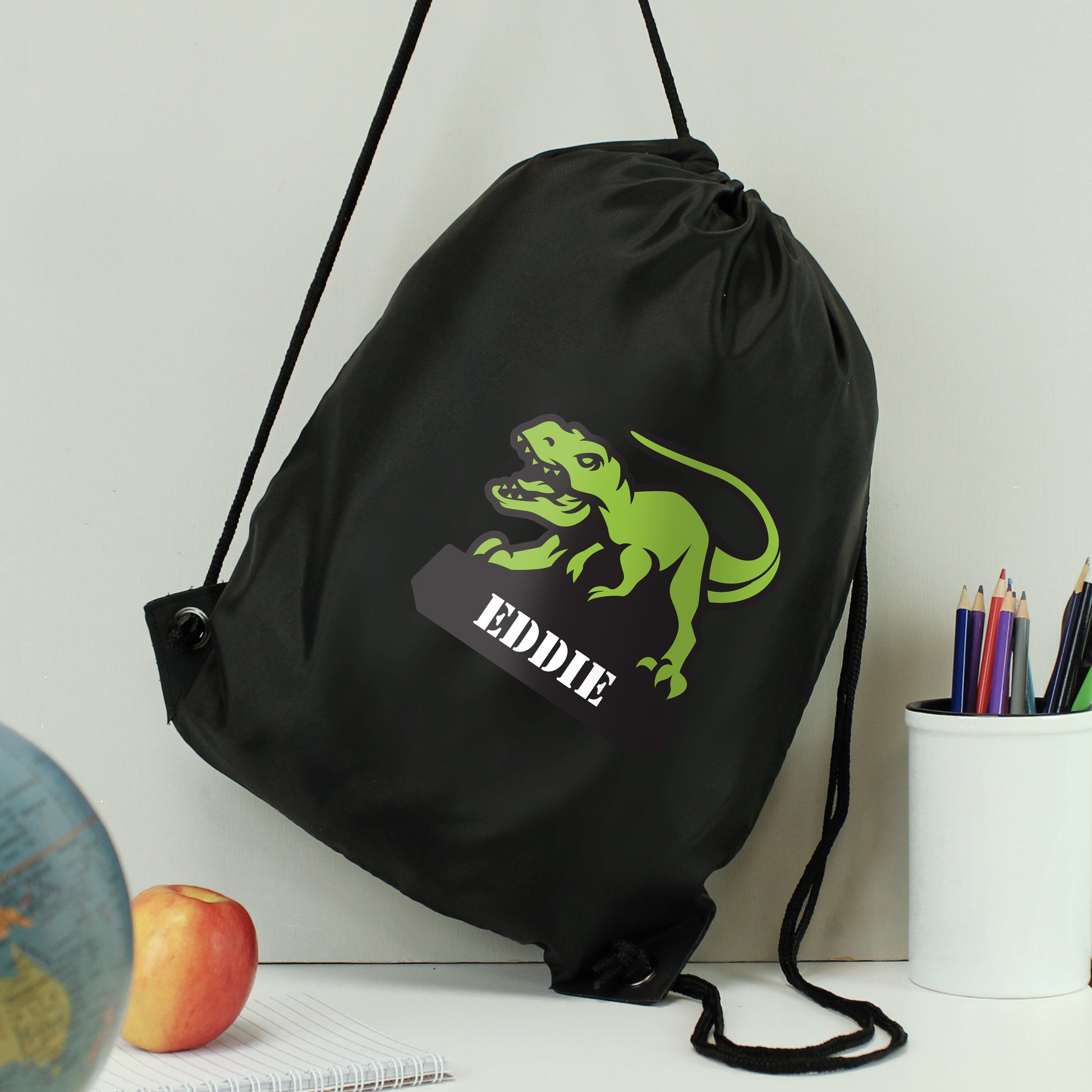 Black drawstring kit bag with dinosaur picture and personalised names