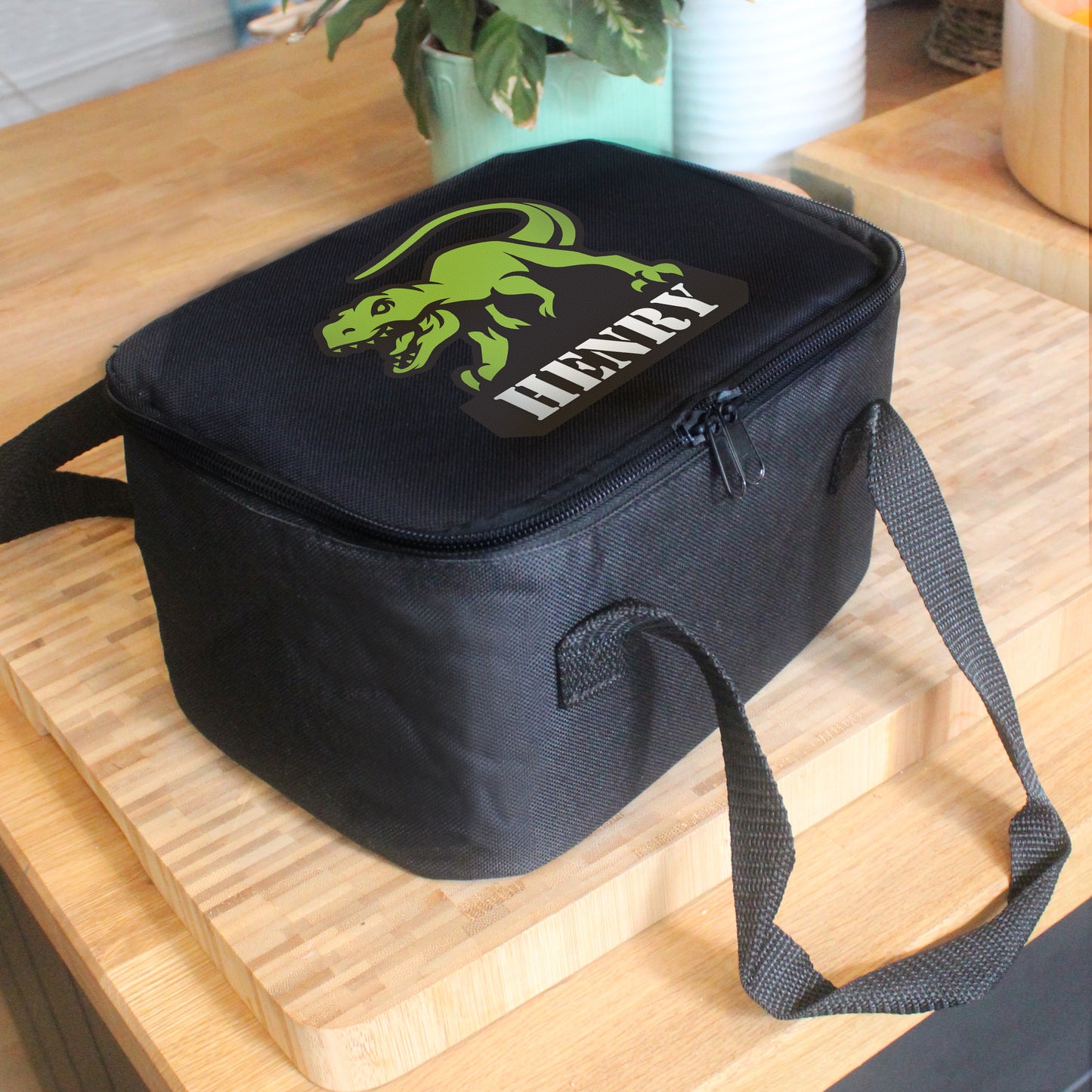 Black lunch bag with picture of t-Rex and personalised with a name