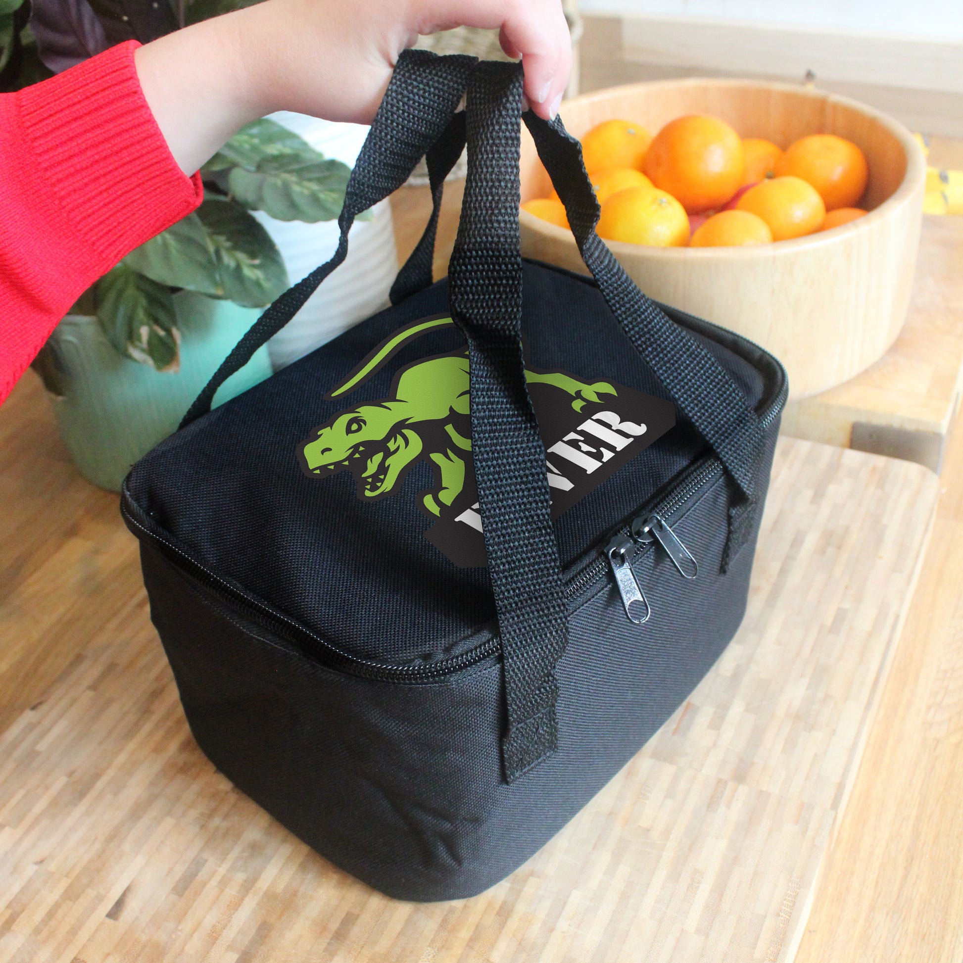 Black lunch bag with picture of t-Rex and personalised with a name