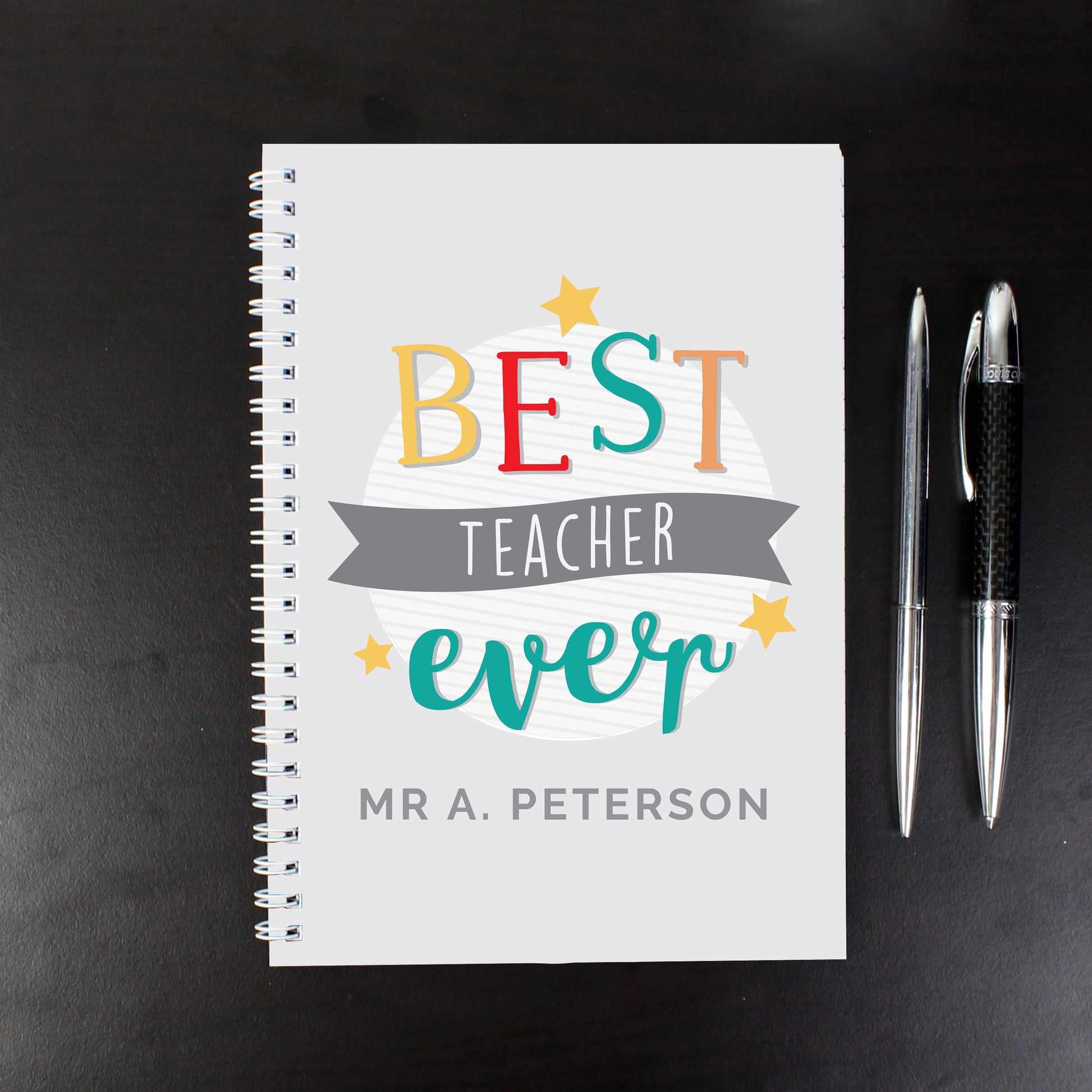 Personalised notebook with words ‘Best Teacher Ever’ and a name