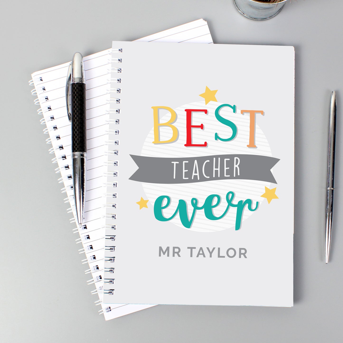 Personalised notebook with words ‘Best Teacher Ever’ and a name