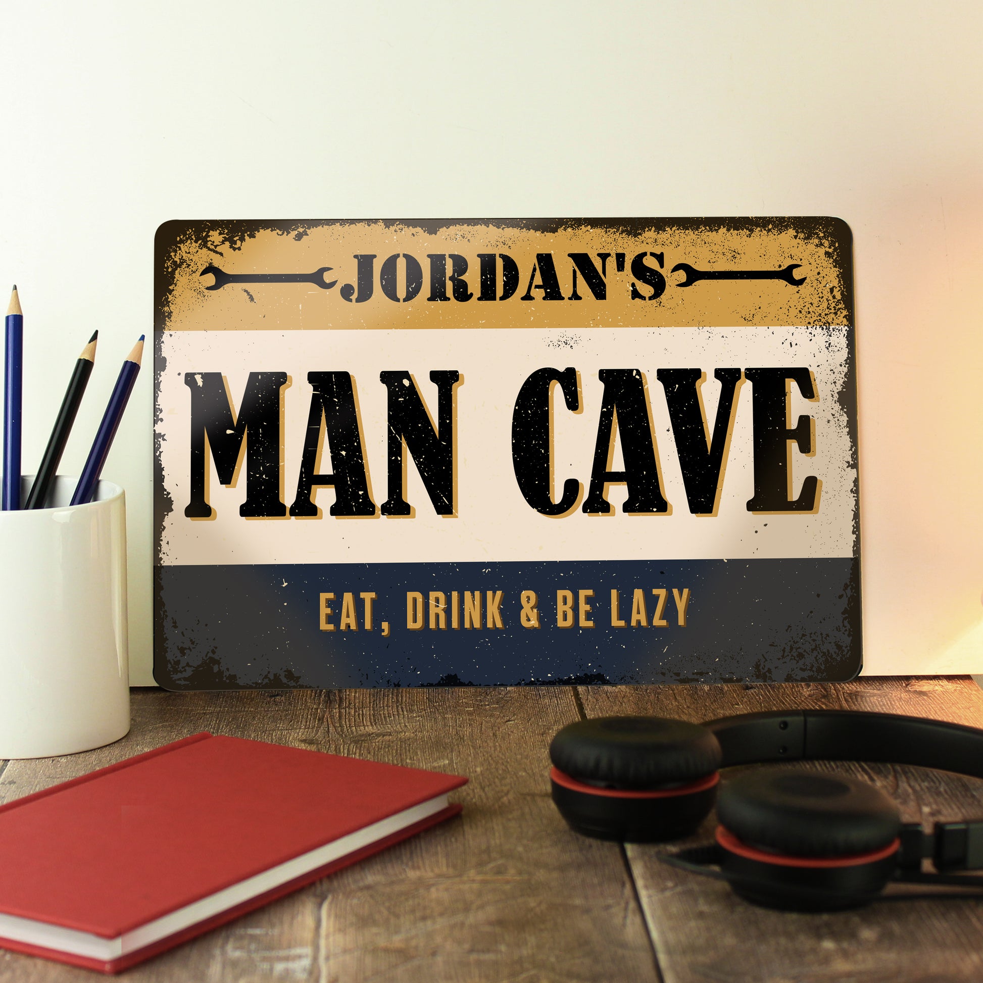 Metal sign with words ‘Jordan’s man cave, eat, drink and be lazy’