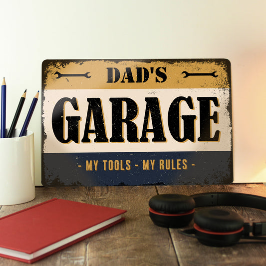 Metal sign with words ‘dads garage, my tools, my rules’