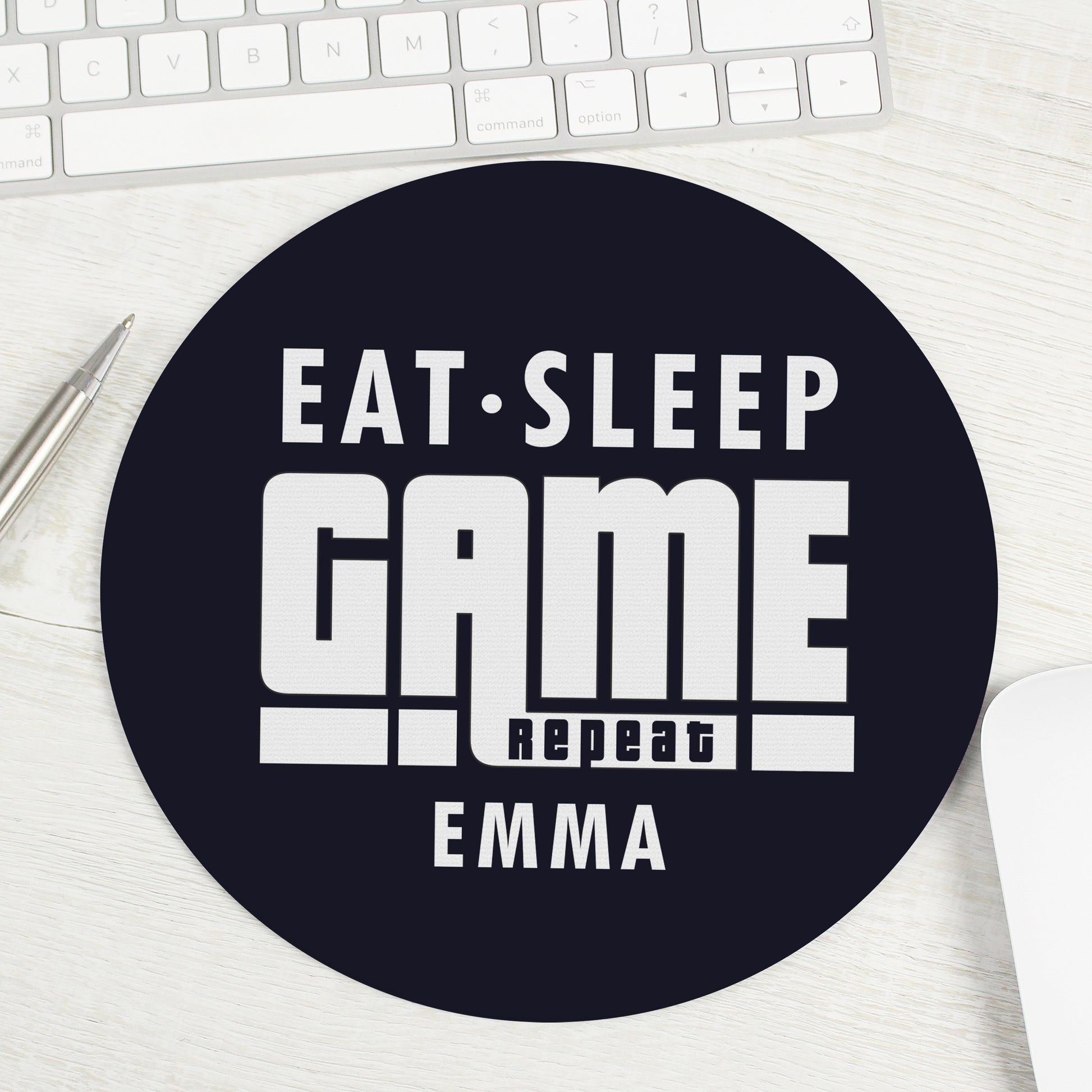 Mouse mat with words ‘Eat, Sleep, Game, Repeat’ and personalised with a name