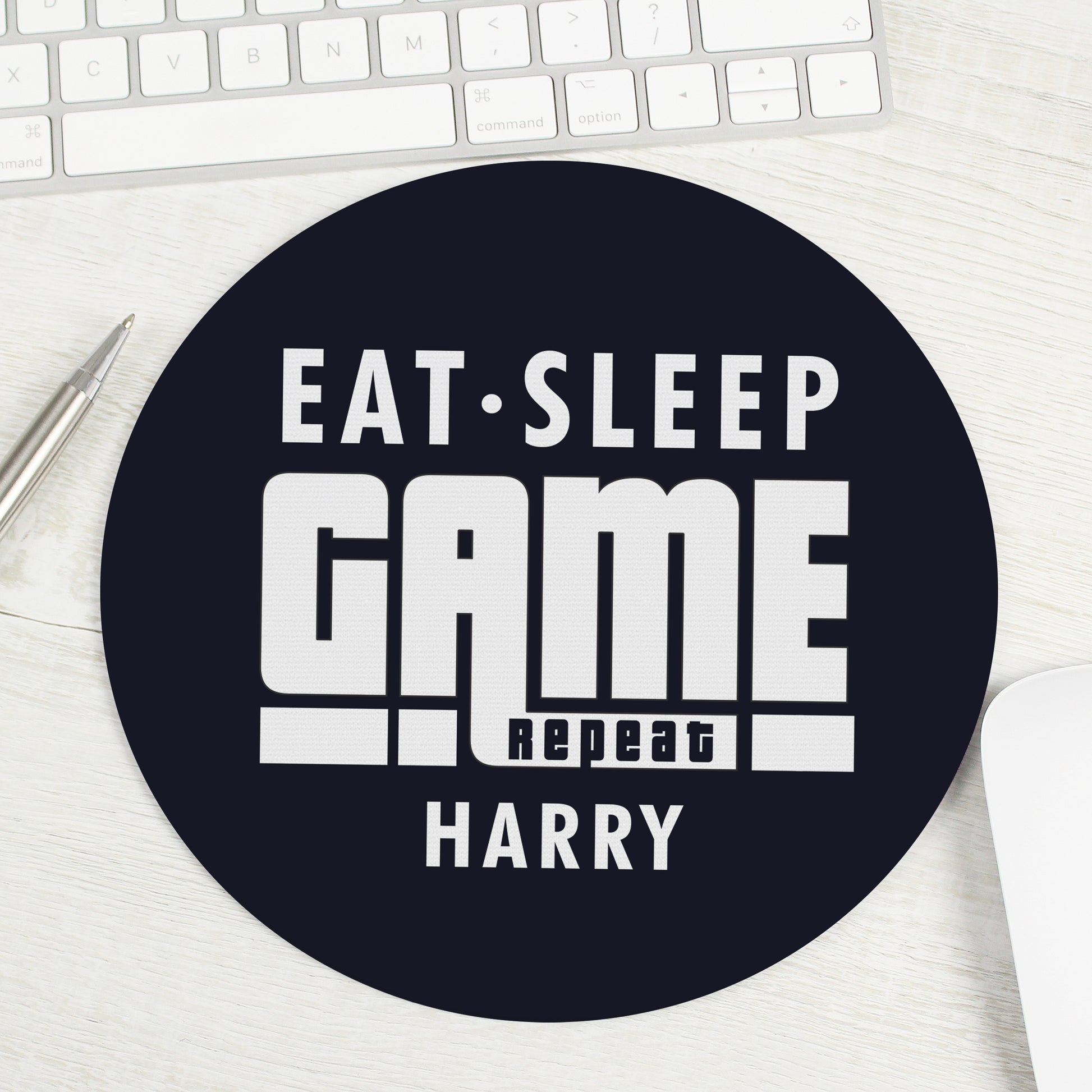 Mouse mat with words ‘Eat, Sleep, Game, Repeat’ and personalised with a name