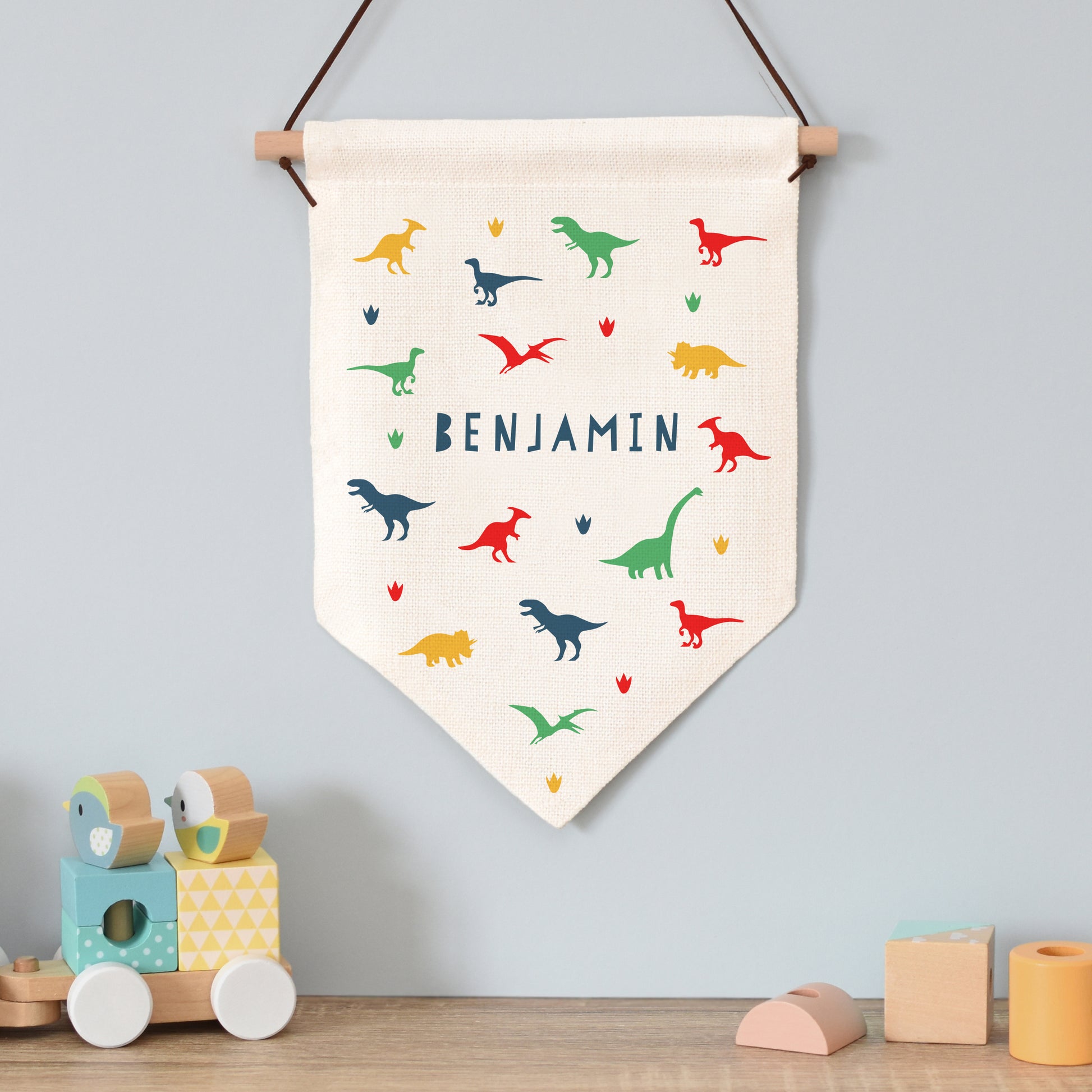 Banner with dinosaur print and personalised with a name