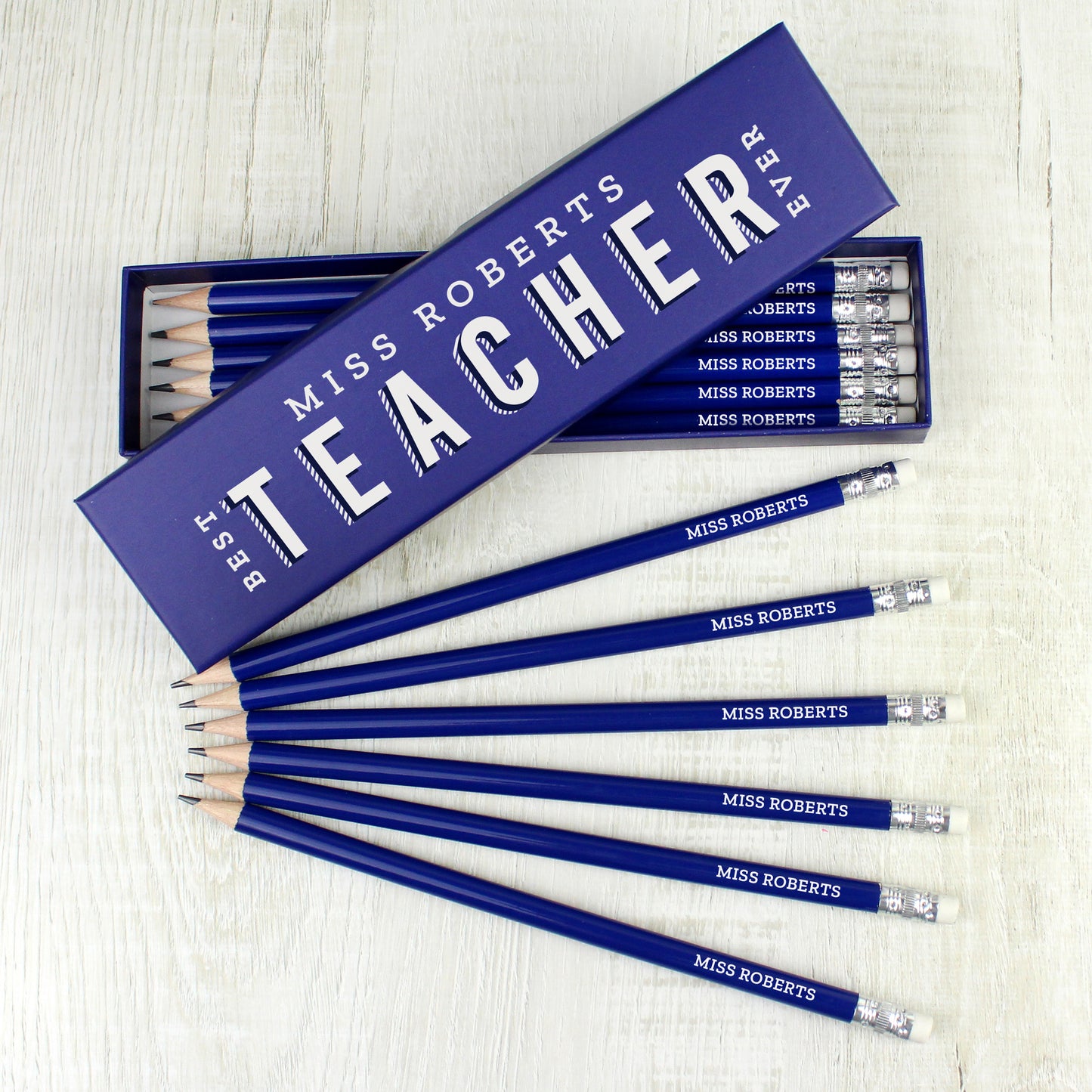 Personalised blue box filled with personalised blue pencils for a teacher