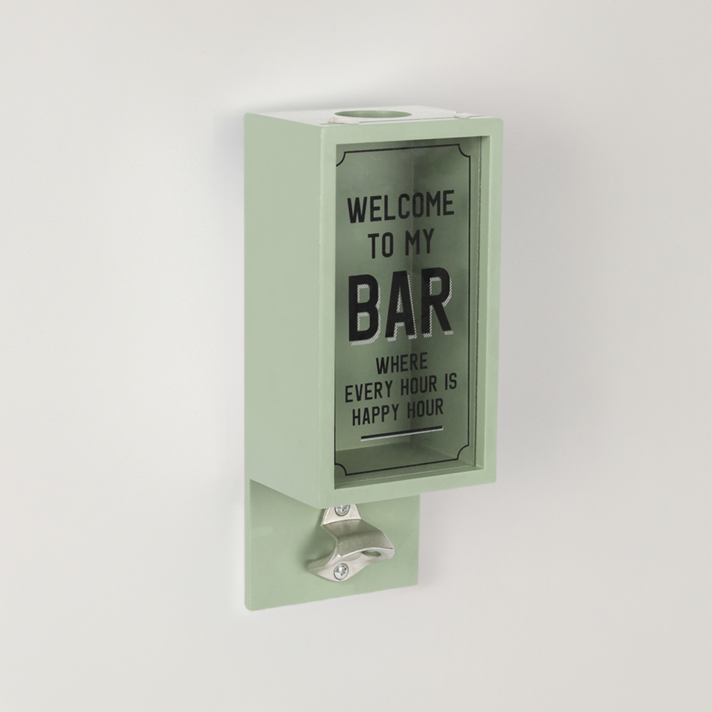 A wall mounted bottle opener with words ‘welcome to my bar’ and a box for collecting lids 