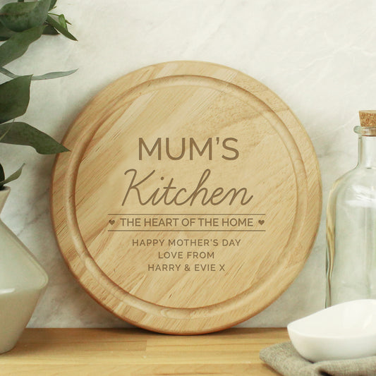 Round chopping board with phrase ‘the heart of the home’